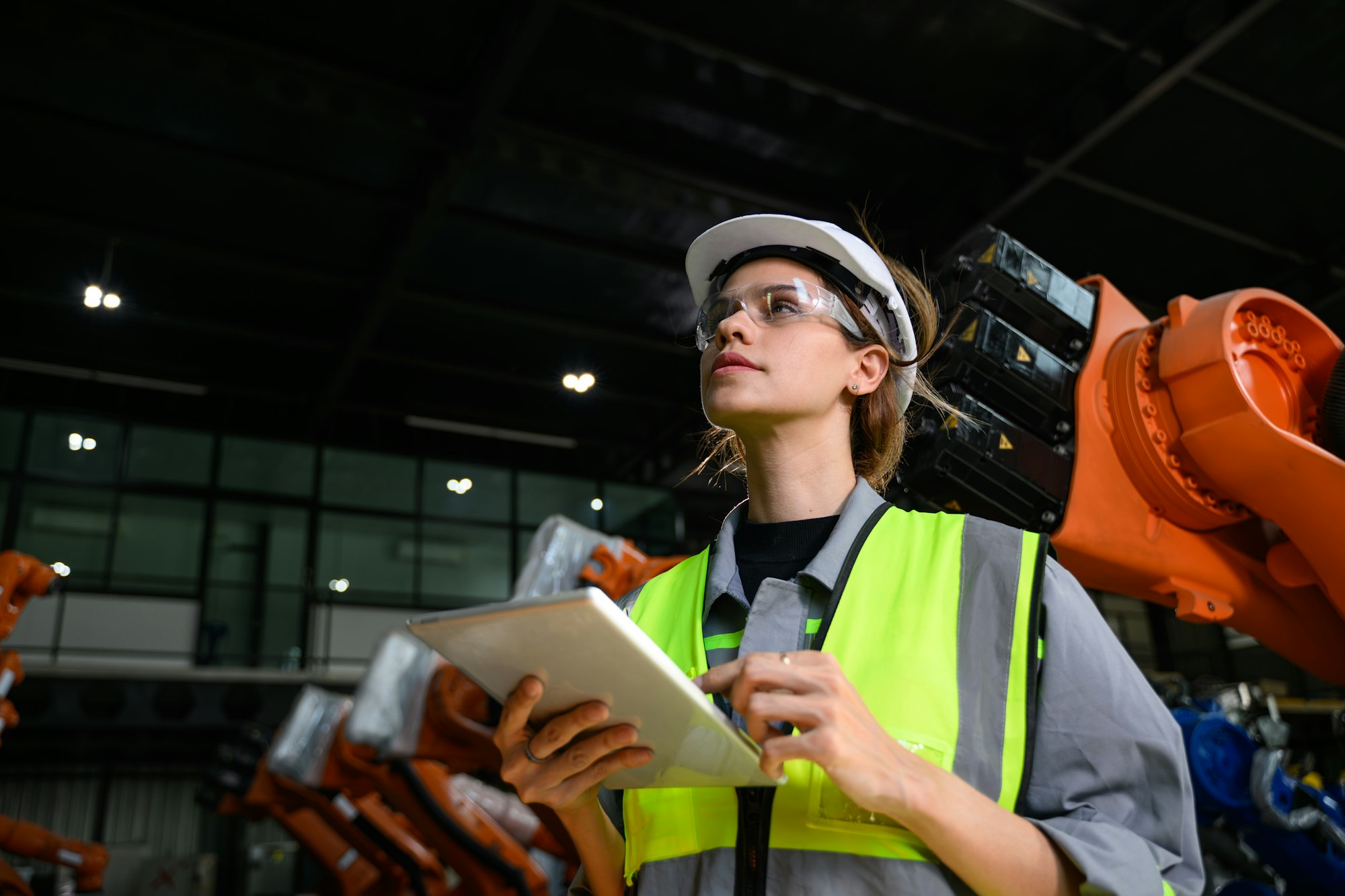 Maintenance engineer worker working with robotic machine automation