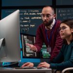 IT Development Supervisor Advising Trainee
